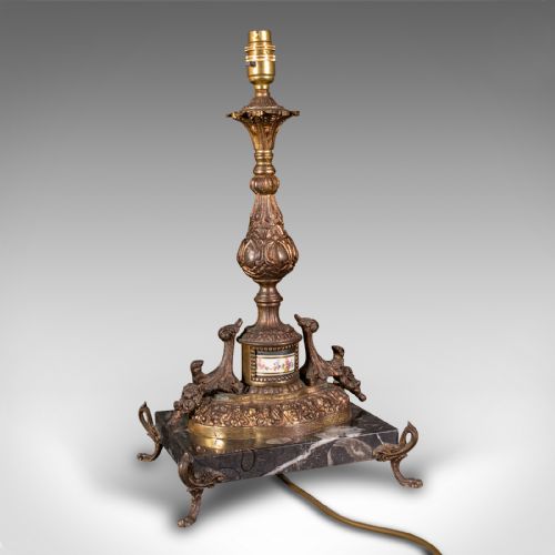 fig 3. A pair of ornate French gilt metal table lamp bases mounted on black veined marble plinths with scrolled feet.