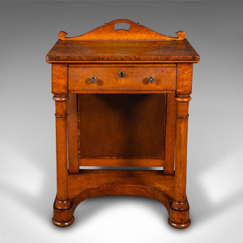 fig 3. An antique burr maple writing desk featuring a scrolled back gallery, a pull-out drawer with a red leather inset skiver, turned column supports, and a shaped plinth base.
