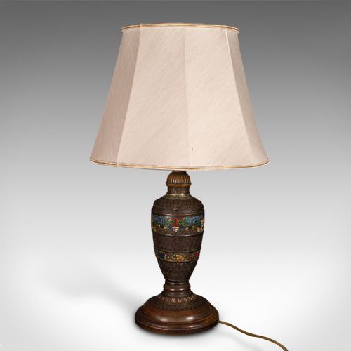 fig 3. An antique Japanese dark bronze vase-shaped table lamp featuring polychrome cloisonne enamel bands and fitted with a cream fabric shade.