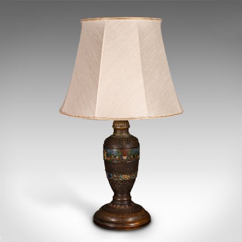 fig 3. An antique Japanese bronze and cloisonne table lamp with colourful enamelled geometric bands and a light beige fabric shade.