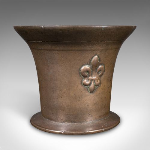 fig 3. A set of three English antique cast bronze apothecary mortars featuring flared rims, circular bases, and raised fleur-de-lis motifs.