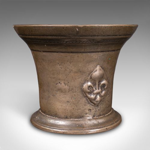 fig 4. A set of three English antique cast bronze apothecary mortars featuring flared rims, circular bases, and raised fleur-de-lis motifs.