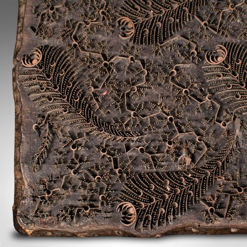 fig 3. A square dark hardwood textile printing block featuring intricate inlaid metal foliage and fern patterns.