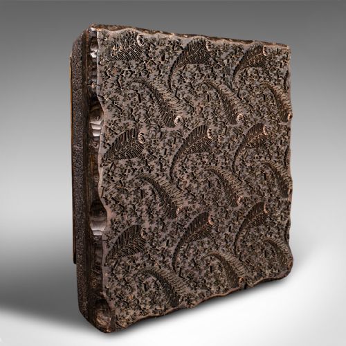 fig 5. A square dark hardwood textile printing block featuring intricate inlaid metal foliage and fern patterns.