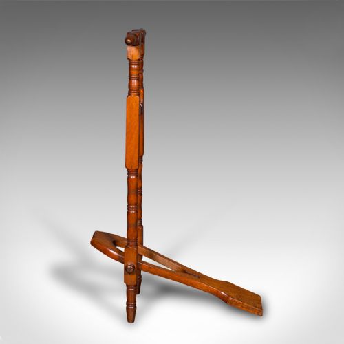 fig 2. A Victorian walnut standing boot jack featuring turned upright supports, a top handlebar, and a folding foot-operated boot pull mechanism.