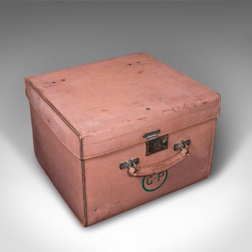 fig 1. An open antique tan brown leather picnic case with a bright green lined interior, internal straps, brass locking mechanism, and a single carrying handle.