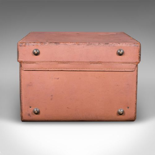 fig 3. An open antique tan brown leather picnic case with a bright green lined interior, internal straps, brass locking mechanism, and a single carrying handle.