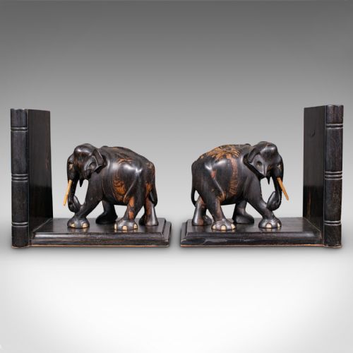 fig 2. Pair of Victorian Anglo-Indian coromandel wood bookends featuring carved elephant figures with bone tusks on L-shaped bases.