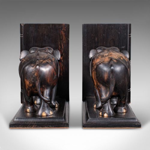 fig 3. Pair of Victorian Anglo-Indian coromandel wood bookends featuring carved elephant figures with bone tusks on L-shaped bases.