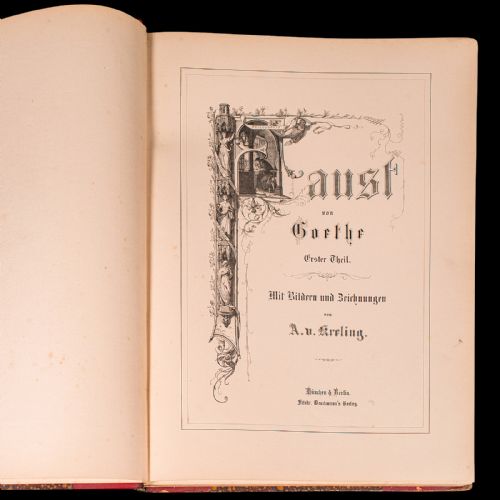 fig 3. A large antique book bound in red leather and marbled brown paper with gold gilt detailing along the spine.
