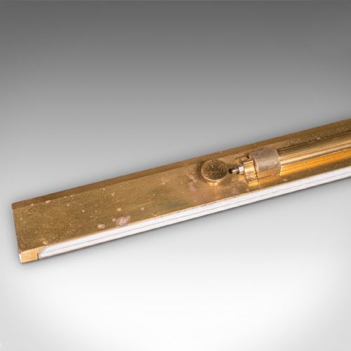 fig 2. An Edwardian antique brass rolling parallel ruler shown alongside its fitted rectangular wooden storage box.