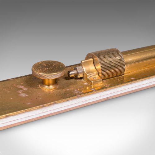 fig 3. An Edwardian antique brass rolling parallel ruler shown alongside its fitted rectangular wooden storage box.