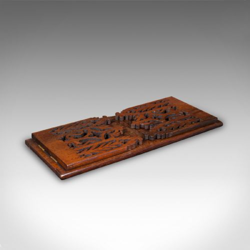 fig 1. A dark oak Victorian extending book slide featuring pierced Gothic fretwork carved ends hinged to an adjustable base.