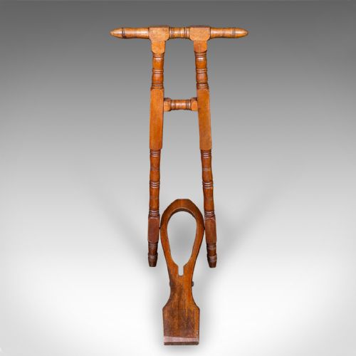 fig 1. A Victorian turned walnut folding standing boot jack with a top hand grip and a u-shaped heel cutout.