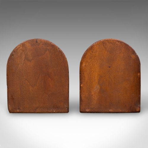 fig 3. A pair of arch-topped antique beech wood bookends decorated with intricate foliate and floral relief carvings.