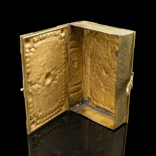 fig 1. An ornate Victorian cast brass keepsake box fashioned in the shape of a book, featuring relief floral and thistle motifs with corner bosses.