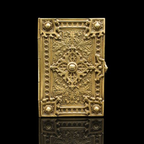 fig 2. An ornate Victorian cast brass keepsake box fashioned in the shape of a book, featuring relief floral and thistle motifs with corner bosses.