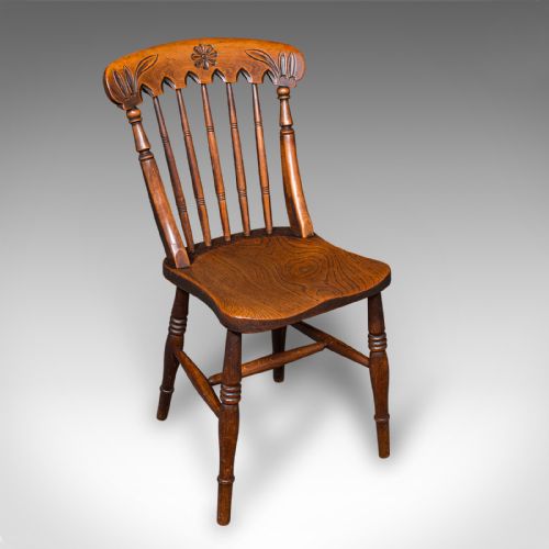 fig 2. A set of three Victorian wooden side chairs featuring carved backrails, turned spindles, and contoured elm seats.