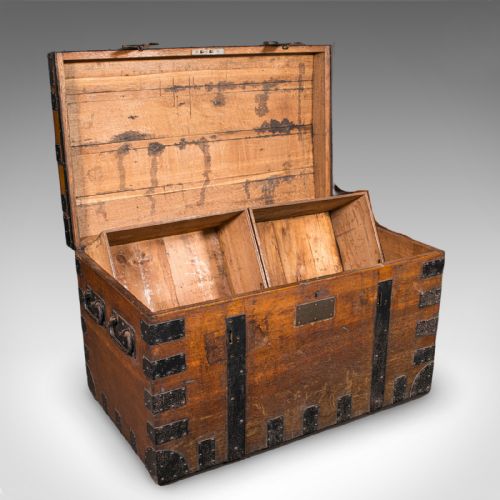 fig 1. A large Victorian oak silver chest reinforced with heavy black iron straps, riveted corner brackets, side handles, and a central brass plate.