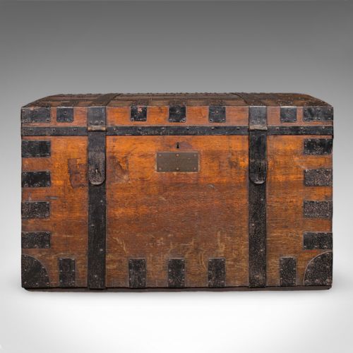 fig 2. A large Victorian oak silver chest reinforced with heavy black iron straps, riveted corner brackets, side handles, and a central brass plate.