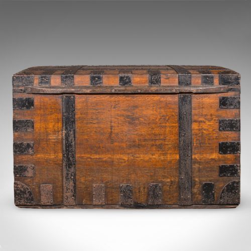 fig 4. A large Victorian oak silver chest reinforced with heavy black iron straps, riveted corner brackets, side handles, and a central brass plate.
