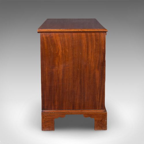 fig 3. An antique Georgian mahogany bachelors chest featuring a brushing slide above two short and two long drawers with brass swan neck handles and bracket feet.