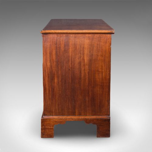 fig 4. An antique Georgian mahogany bachelors chest featuring a brushing slide above two short and two long drawers with brass swan neck handles and bracket feet.