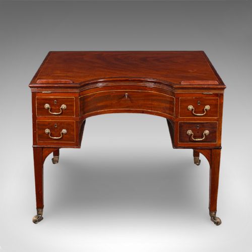 fig 2. A Regency mahogany metamorphic architects desk featuring an adjustable tilted top on ratchet risers above a kneehole drawer base with brass handles.