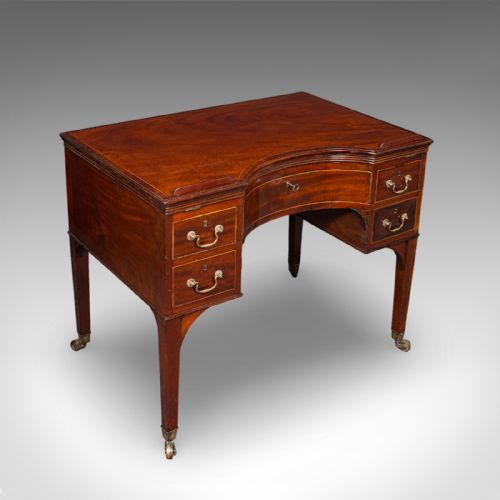fig 3. A Regency mahogany metamorphic architects desk featuring an adjustable tilted top on ratchet risers above a kneehole drawer base with brass handles.