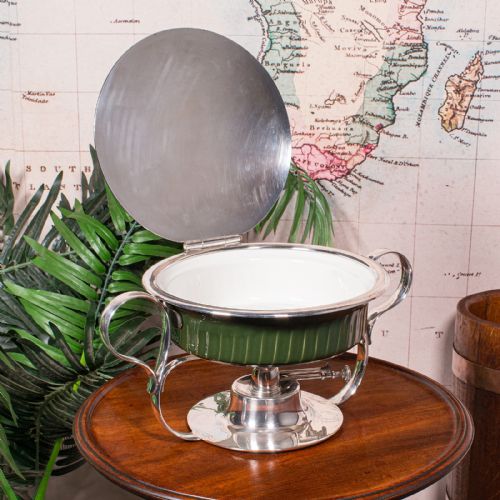 fig 1. An Edwardian silver-plated chafing dish featuring a ribbed green ceramic liner, double loop handles, a fitted lid, and an integrated spirit burner base.