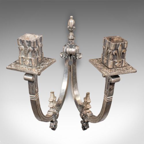 fig 2. A pair of antique French silvered metal twin-branch candle sconces with fleur-de-lis detailing and square sockets.