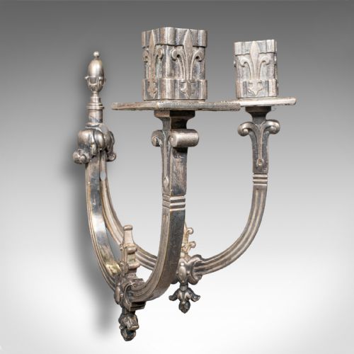 fig 3. A pair of antique French silvered metal twin-branch candle sconces with fleur-de-lis detailing and square sockets.