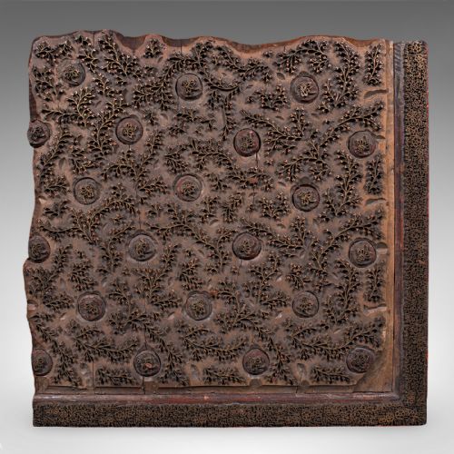 fig 2. A square Victorian wooden wallpaper printing block crafted from dark wood with raised brass pins forming a repeating pattern.