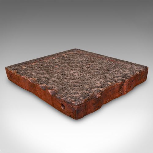 fig 3. A square Victorian wooden wallpaper printing block crafted from dark wood with raised brass pins forming a repeating pattern.