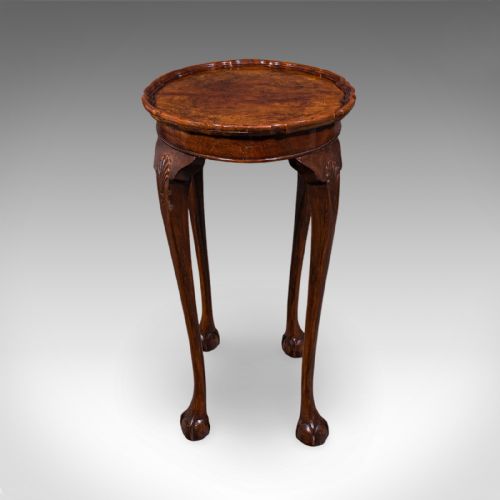 fig 2. An Edwardian burr walnut oval side table featuring a raised pie crust edge and carved cabriole legs.