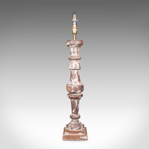 fig 3. A pair of tall turned pine table lamp bases with heavily distressed grey-white paint revealing natural timber beneath.