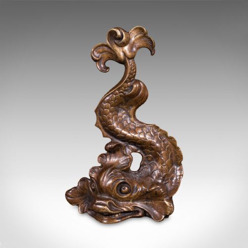 fig 1. A heavy cast bronze Regency period doorstop sculpted in the form of a stylised mythical dolphin with an integrated tail handle.