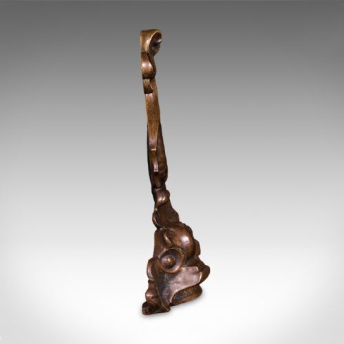 fig 2. A heavy cast bronze Regency period doorstop sculpted in the form of a stylised mythical dolphin with an integrated tail handle.