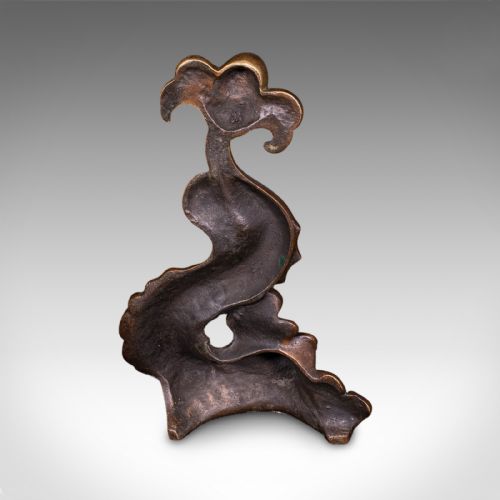 fig 3. A heavy cast bronze Regency period doorstop sculpted in the form of a stylised mythical dolphin with an integrated tail handle.