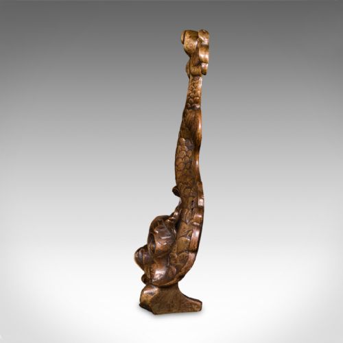 fig 4. A heavy cast bronze Regency period doorstop sculpted in the form of a stylised mythical dolphin with an integrated tail handle.