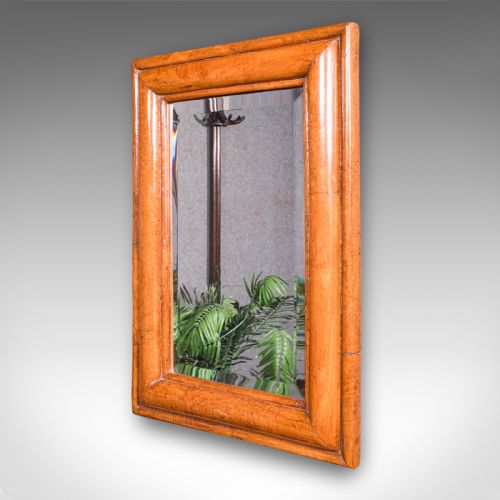 fig 2. An antique Edwardian rectangular wall mirror featuring a cushion-moulded warm brown walnut frame and a bevelled mirror plate.