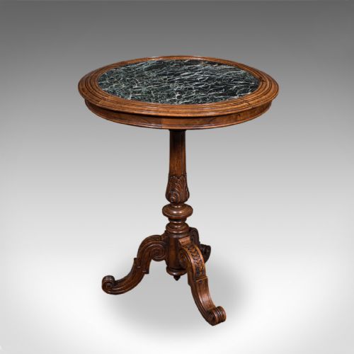 fig 2. A High Victorian walnut wine table with a circular green marble inset top set on a carved tripod pedestal base.