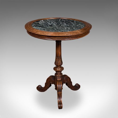 fig 3. A High Victorian walnut wine table with a circular green marble inset top set on a carved tripod pedestal base.