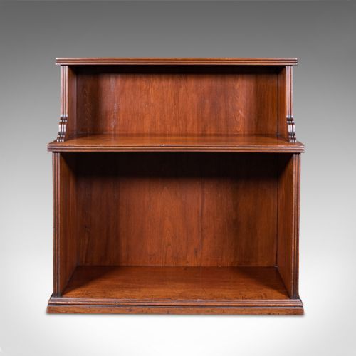 fig 1. A Victorian mahogany two-tier open campaign folio bookcase featuring brass side carrying handles and a stepped upper shelf.
