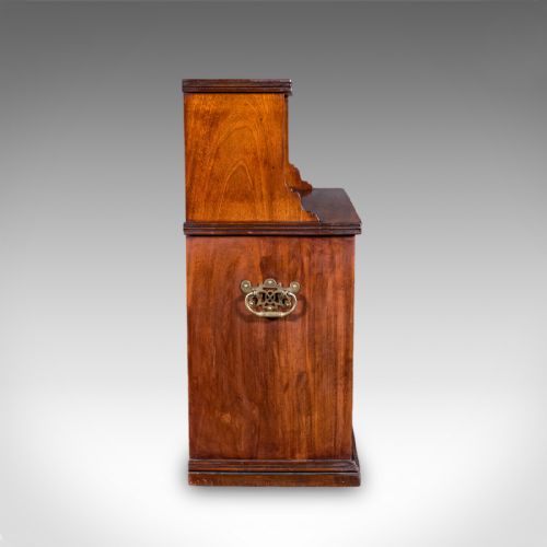 fig 2. A Victorian mahogany two-tier open campaign folio bookcase featuring brass side carrying handles and a stepped upper shelf.