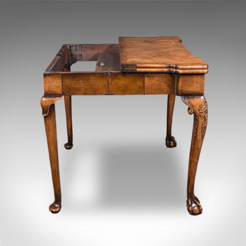 fig 3. An antique English Georgian walnut card table featuring cabriole legs with carved knees, claw and ball feet, and a square green baize playing surface.