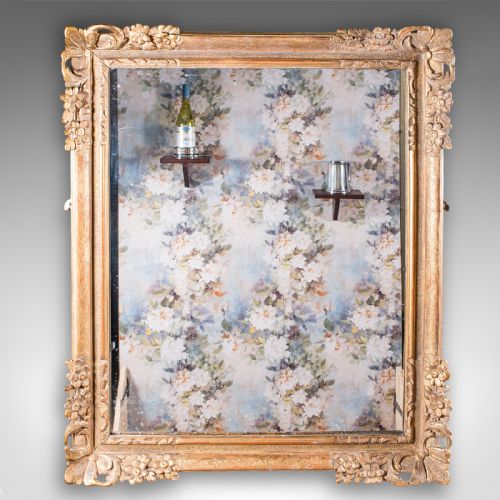 fig 2. A pair of large rectangular Regency style wall mirrors with ornate gold giltwood frames and floral corner embellishments.