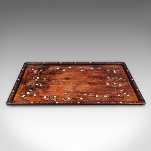 fig 1. A rectangular dark brown teak wood tray featuring intricate floral bone and brass wire inlay around the borders.