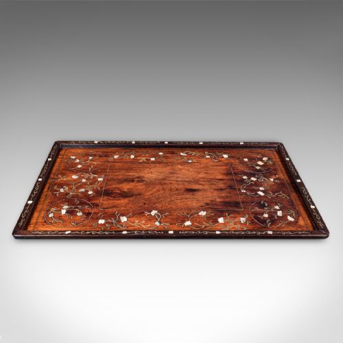 fig 2. A rectangular dark brown teak wood tray featuring intricate floral bone and brass wire inlay around the borders.