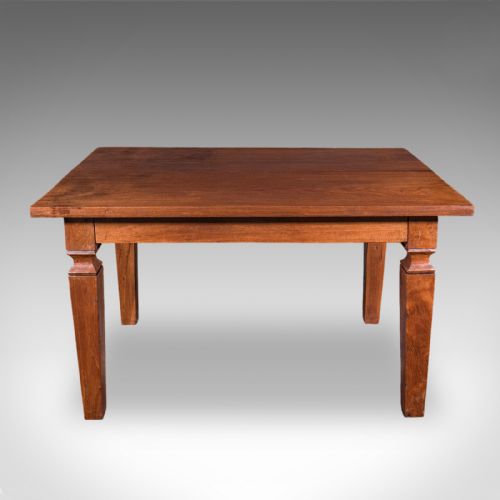 fig 1. An Edwardian rectangular English walnut dining table featuring tapered legs with carved collars and a smooth polished top.